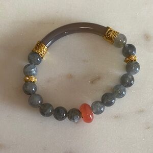 Elegant Grey Beaded Bracelet with Coral Accent and Gold Details